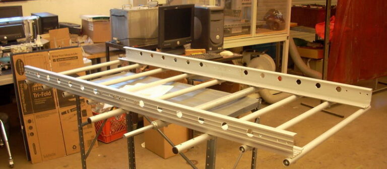 A metal frame being welded together in a workshop